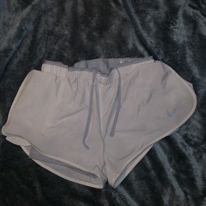 White Nike running shorts